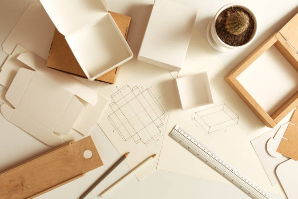 istock Designer desktop. Sketches of drawings for eco-friendly packaging. 1303532706