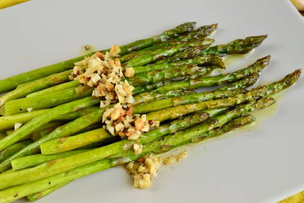 istock Roasted green asparagus with garlic 1303532707