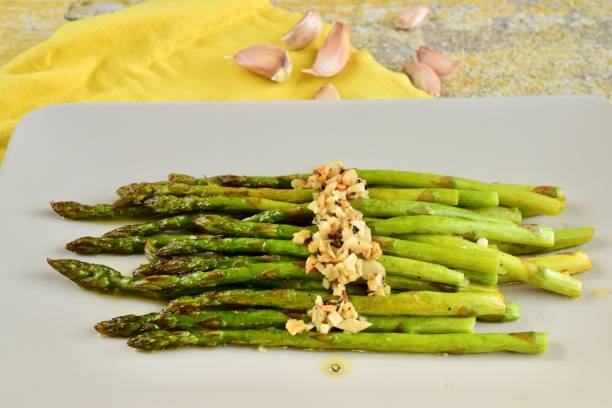 istock Roasted green asparagus with garlic 1303532776