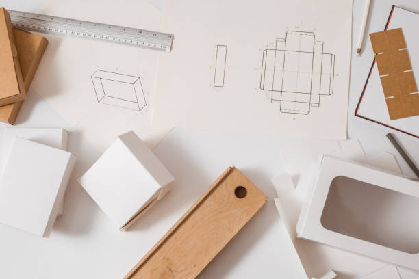 istock Designer desktop. Sketches of drawings for eco-friendly packaging. 1303532786