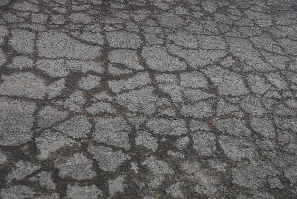 istock gray black stone texture of asphalt 1303535503