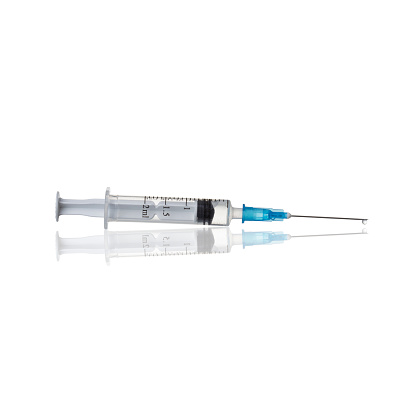Hypodermic syringe and needle with liquid on white background. The needle also has liquid measurement markings on its shaft.