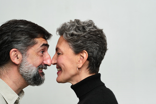 Cut out studio portrait.
Made in Barcelona
Real People.
A Middle-aged couple. look at each other.