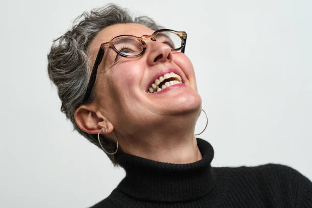 istock One woman laughing out loud. 1303539361