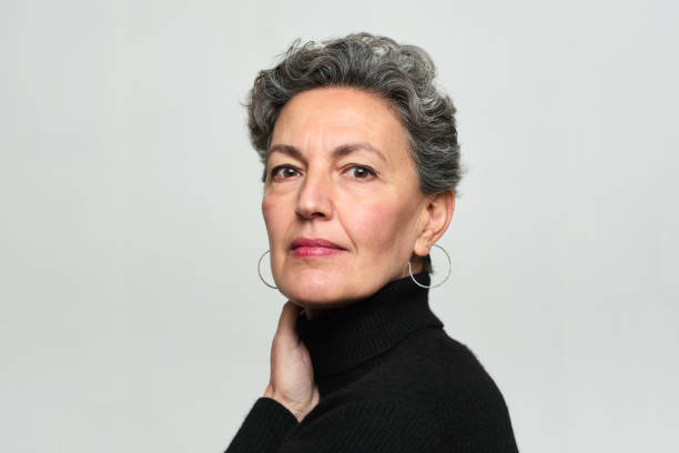 istock One elegant woman studio portrait. 1303539366