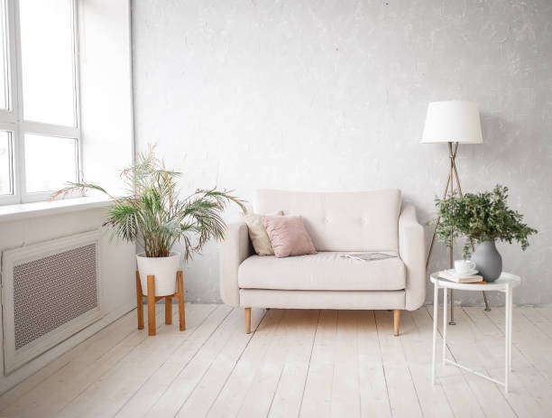 istock Interior of a light room with a sofa. Living room. 1303545665