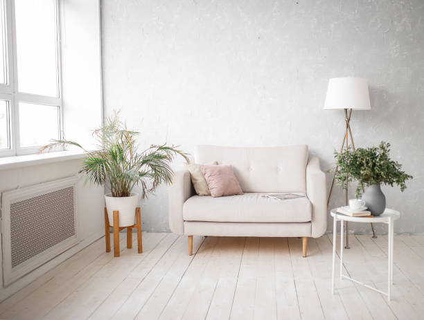 Interior of a light room with a sofa. Living room. stock photo