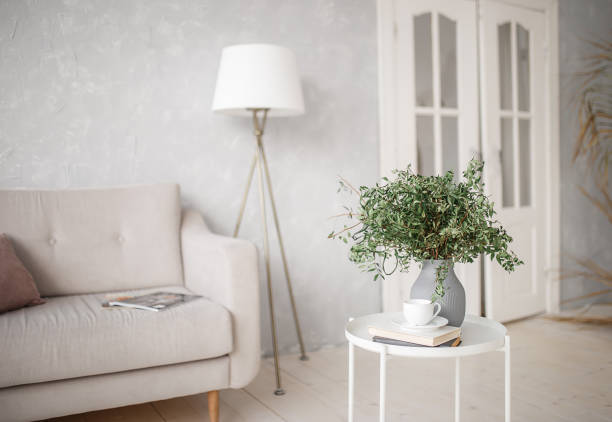 istock Interior of a light room with a sofa. Living room. 1303545775