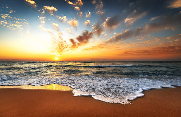 istock Sunset sea waves sky clouds landscape. 1303546639