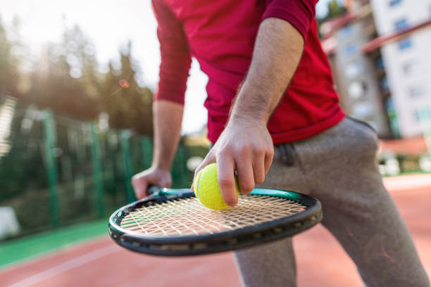 istock Tennis player preparing to serve the ball 1303547064
