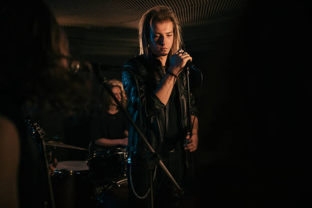 istock Music band performing at rock concert 1303547506