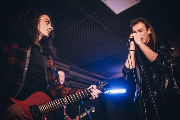 istock Music band performing in nightclub 1303548335