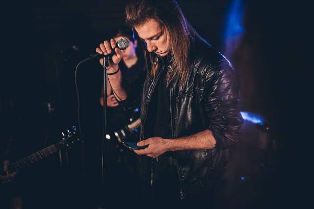 istock Music band performing in nightclub 1303548688