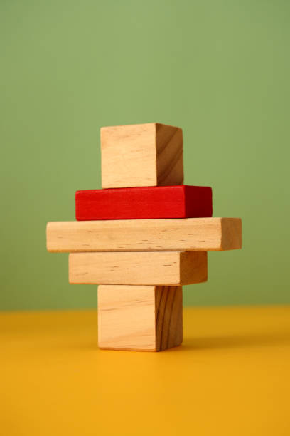 istock Wood blocks on color background 1303549774
