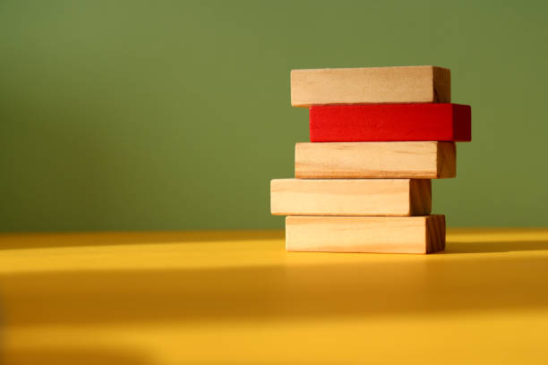 istock Wood blocks on color background 1303549809