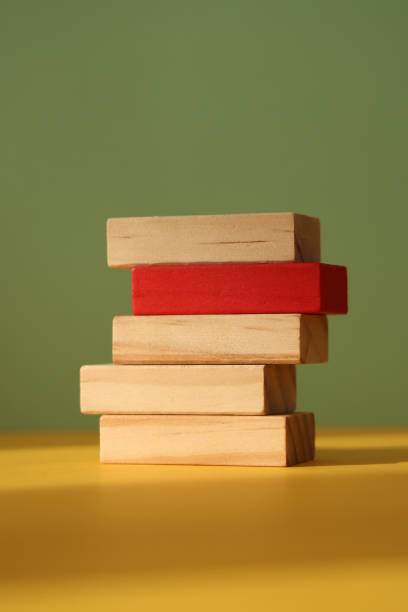 istock Wood blocks on color background 1303549840