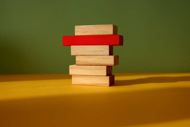 istock Wood blocks on color background 1303549878