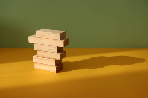 istock Wood blocks on color background 1303549990