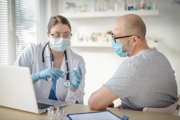 istock doctor and patient in a medical office 1303551161