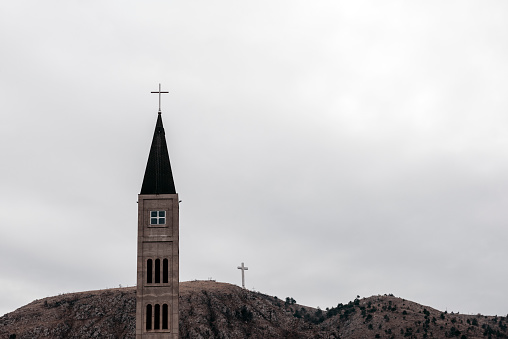 Photo of Church and a huge cross on a hill. Mostar, Bosnia and Herzegovina