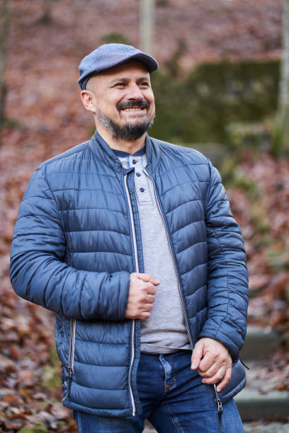 istock Middle age man in the park 1303552203