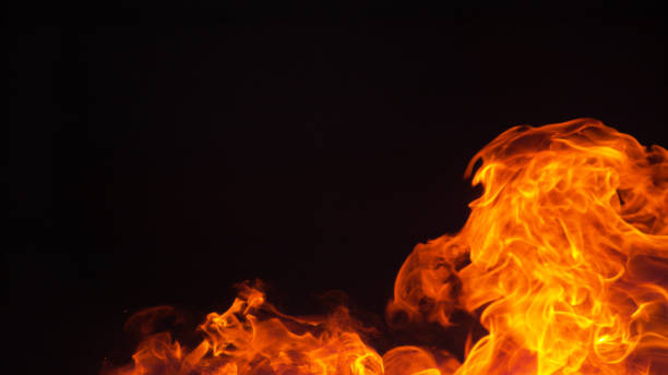 istock COPY SPACE Beautiful shot of campfire flames flickering in the midnight darkness 1303553225