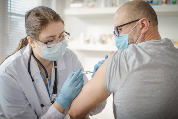 istock doctor and patient in a medical office 1303553578