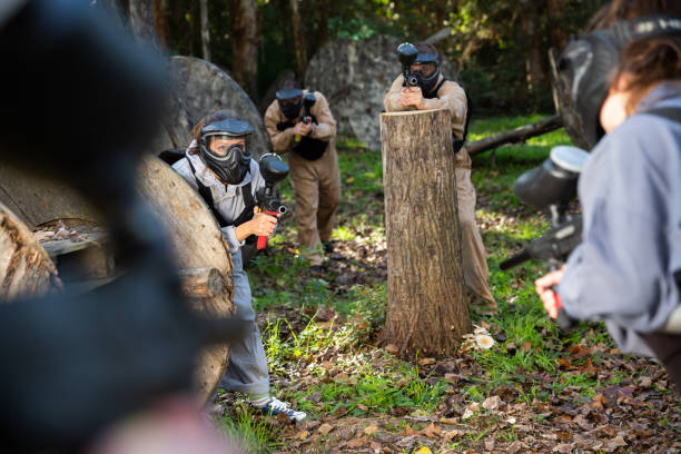 istock People playing paintball outdoors 1303553611