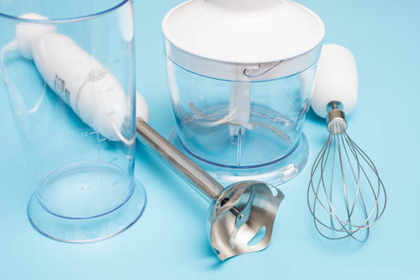 istock Electric hand mixer. Modern electric kitchen appliances for making sauces, smoothies, puree. Hand mixer set. 1303554714