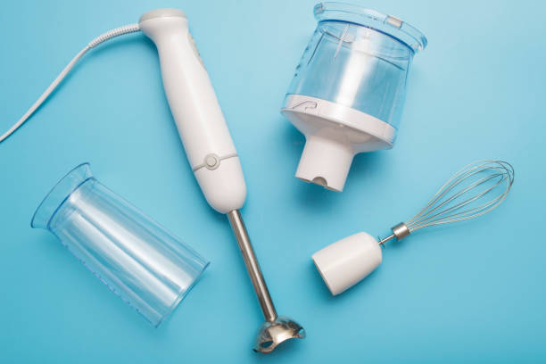 istock Electric hand mixer. Modern electric kitchen appliances for making sauces, smoothies, puree. Hand mixer set. 1303554725