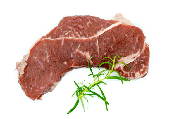 istock Beef steak, view of fresh beef isolated on white with rosemary, black pepper 1303556877