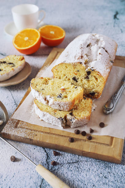 istock Orange cake with chocolate, powdered sugar dressing 1303559245