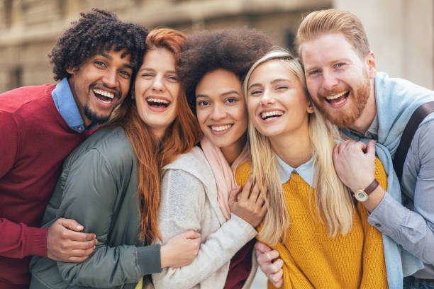 Friends Portrait of happy multi-ethnic group of friends outdoor cheek to cheek photos stock pictures, royalty-free photos & images