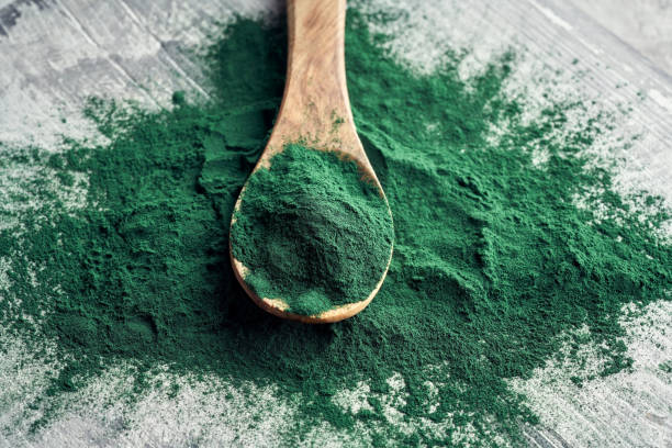 istock Green spirulina powder 1303561498