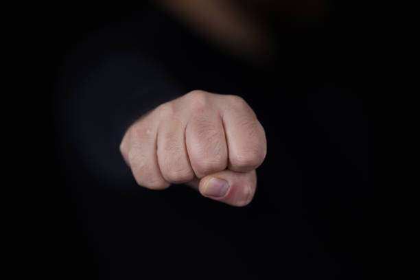 istock close up hand of a man. a strong punch 1303561568
