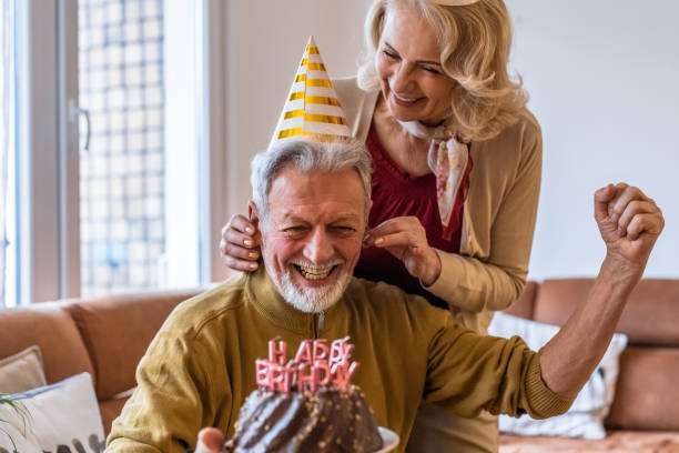 istock Senior couple at home, celebrating birthday 1303562182