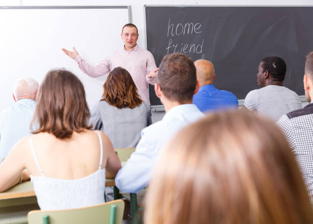 istock Young lecturer talking to mixed age  students 1303562605