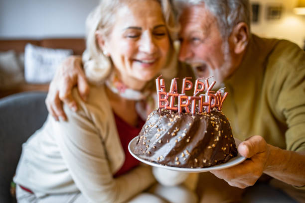 istock Senior couple at home, celebrating birthday 1303563337