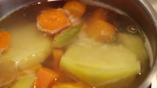 Blanching vegetables in cooking pot preparation