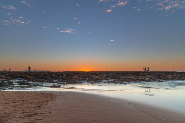 Hazy sunrise with clear skies at North Avoca Beach on the Central Coast, NSW, Australia.