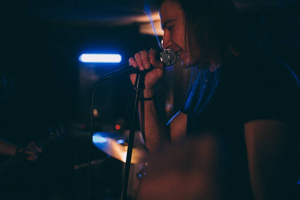 istock Male vocalist singing on bend rehearsal 1303574080