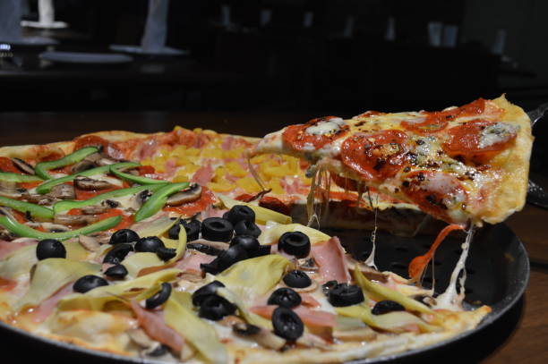 istock Gourmet Stone Oven Made Pizza 1303574350