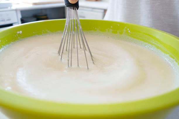 istock Woman preparing pancake batter 1303577306