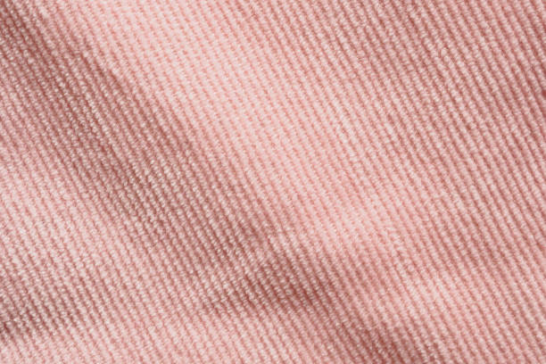 istock Pink fabric cloth texture background close up 1303581689