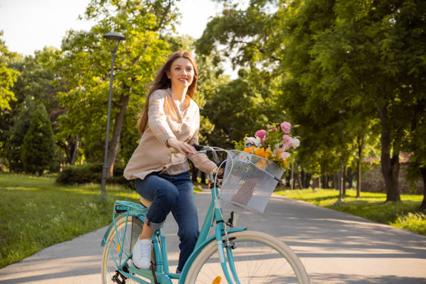 istock Cute lady riding a bicycle 1303581710