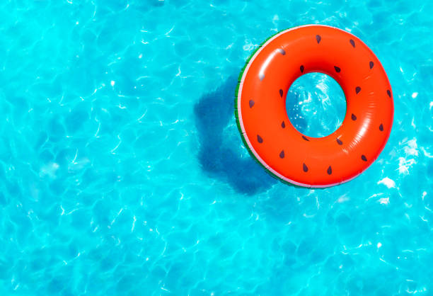 istock Inflatable red watermelon swim in a swimming pool 1303581888