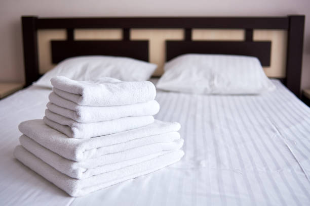 Clean towels on bed at hotel room