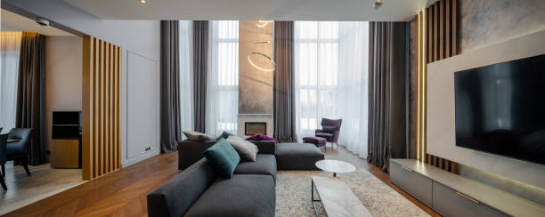 istock Interior of luxury apartment. Modern design. Huge cozy sofa. 1303590233