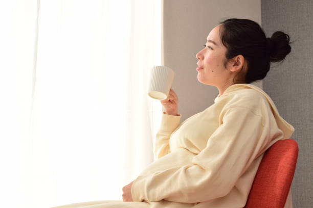 istock pregnant woman with a mug 1303590302