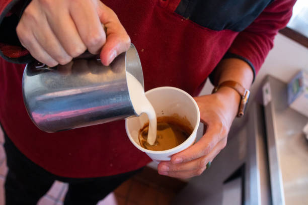 istock Pouring Milk into Latte 1303591087